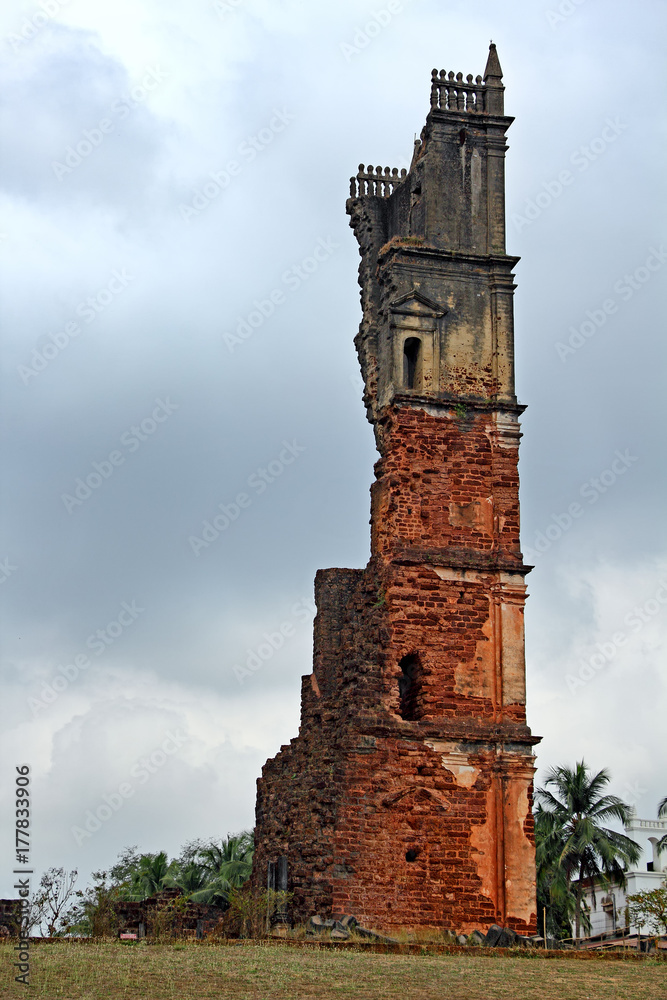 Ruins of 46 meter high belfry of the Church of St Augustine in Old Goa, India. Built by Augustinian friars and abandoned in 1835