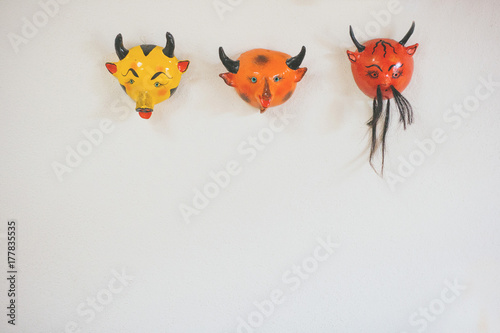 devil masks as wall decor. photo