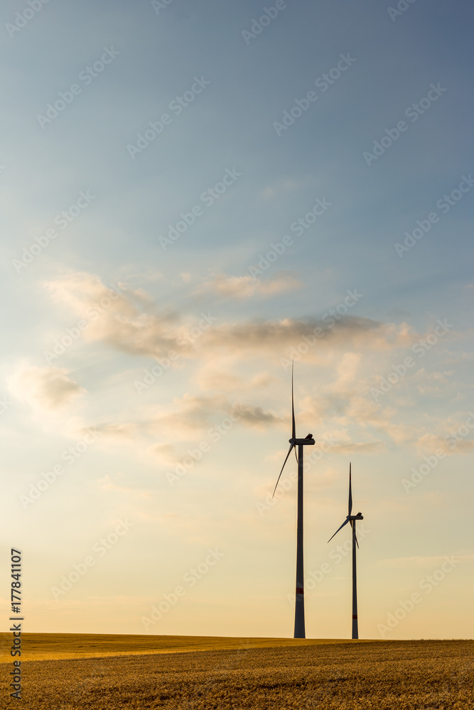 Obraz premium Wind turbines during sunset