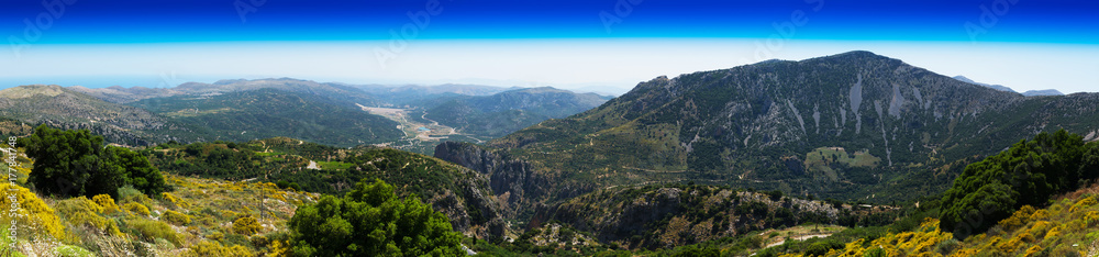 Horizontal wide panorama of Crete valley landscape background