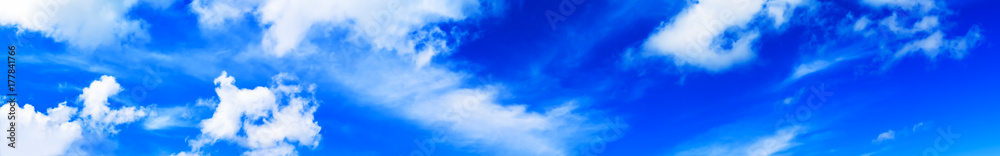 Fototapeta premium Horizontal wide high altitude dramatic blue loudscape panorama b