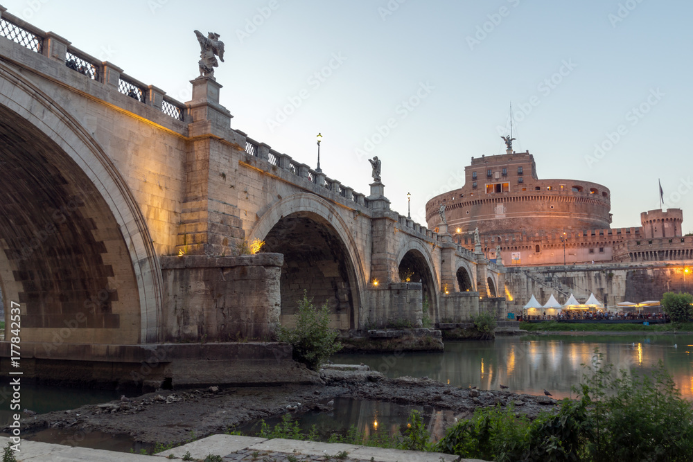 Amazing Sunset view of St. Angelo Bridge and castle st. Angelo in city of Rome, Italy