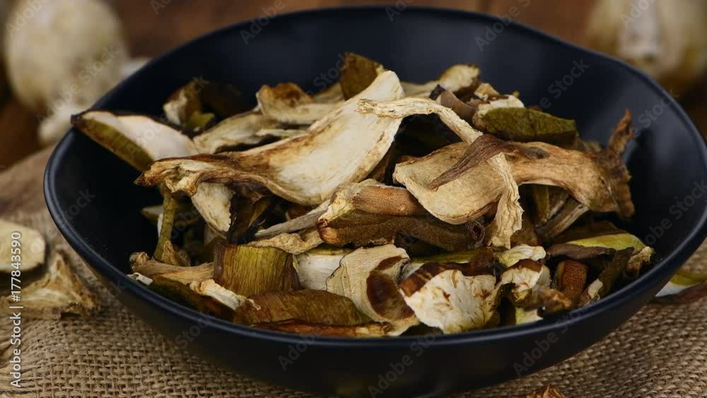 Dried Porcinis rotating on a wooden plate as seamless loopable 4K UHD footage Dried Porcinis rotating on a wooden plate as seamless loopable 4K UHD footage