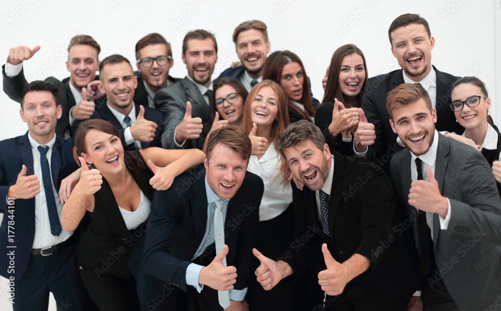 successful business team showing thumbs up successful business team showing thumbs up
