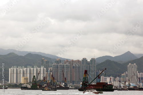 A port of Hong Kong China and shipping containers, buildings and the sea