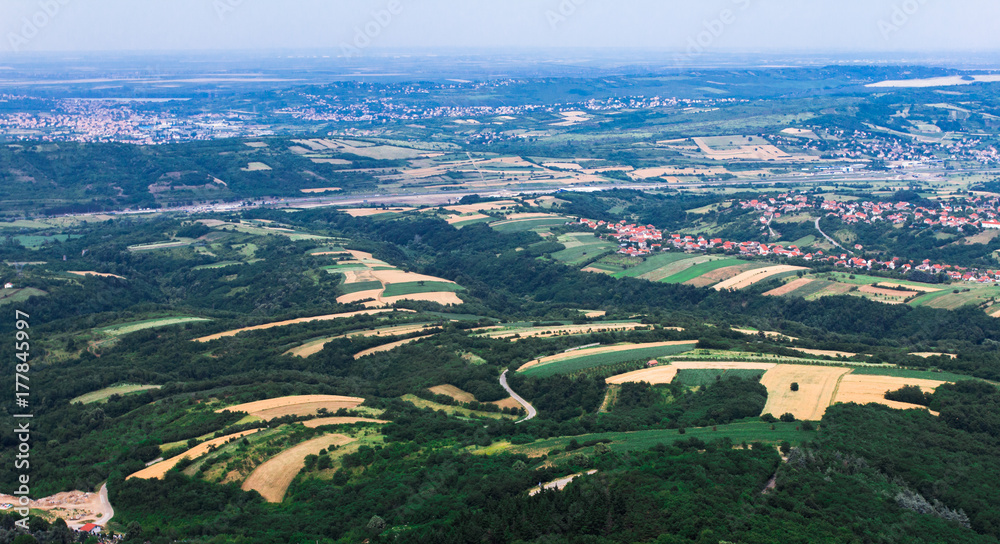 Fields and Villages from high viewpoint. Belgrade countryside, Serbia. An aerial top-view 