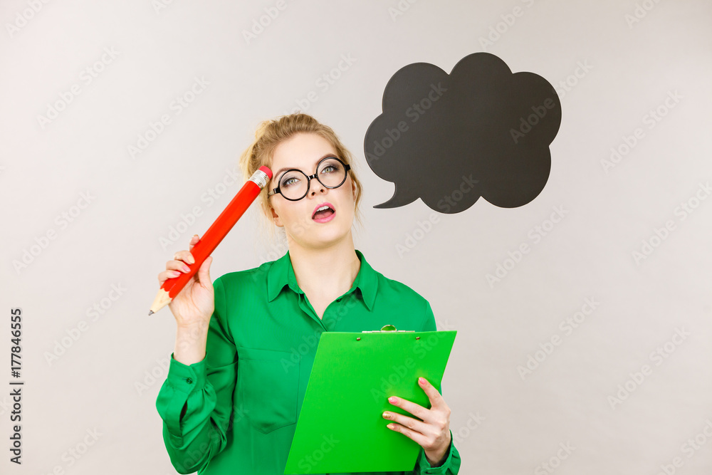 Business woman intensive thinking and writing Business woman intensive thinking and writing