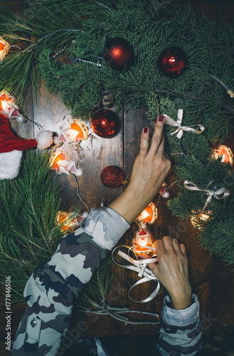 Woman creating Christmas decorations photo