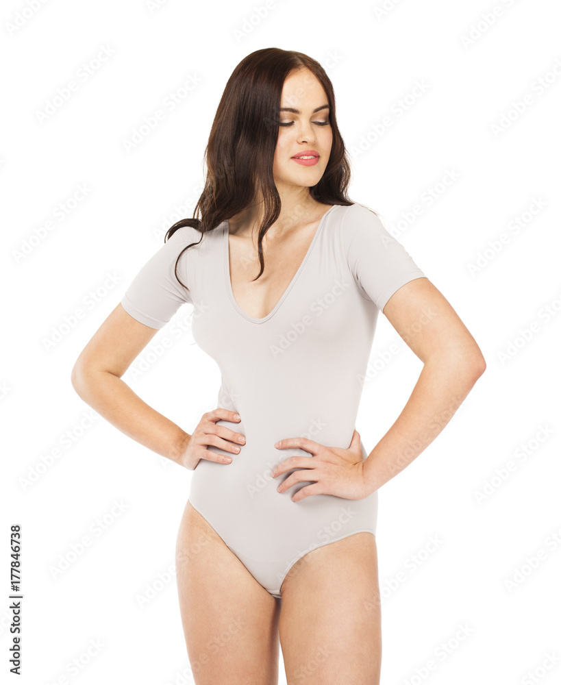 Young beautiful woman in gray fitness body clothing Young beautiful woman in gray fitness body clothing