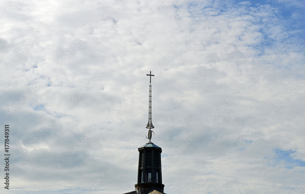 Christian background photo of a church steeple with a cross