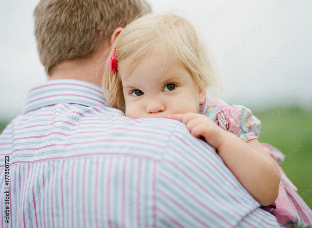 Father holding and playing with his daughter Father holding and playing with his daughter
