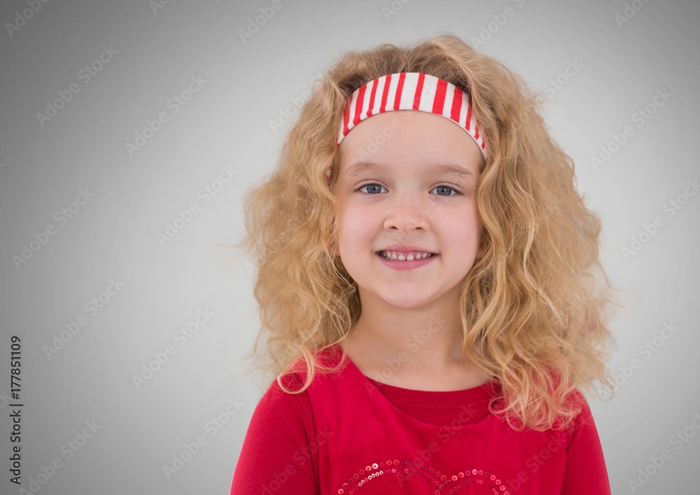 Girl against grey background with hairband
