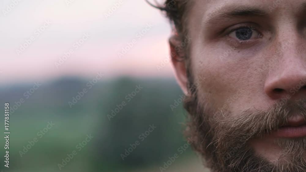 Portrait of one part of beraded, blue-eyed man. Slowly Portrait of one part of beraded, blue-eyed man. Slowly