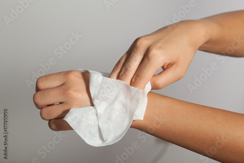 Cleaning hands with wet wipes