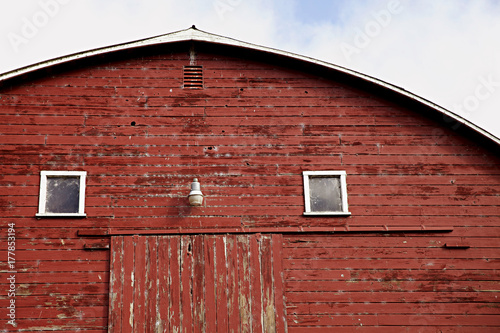 close up photo of old red wooden barn in the country photo