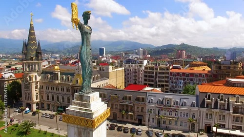 Monument to Medea in Europe Square in Batumi Georgia against cityscape, aerial 