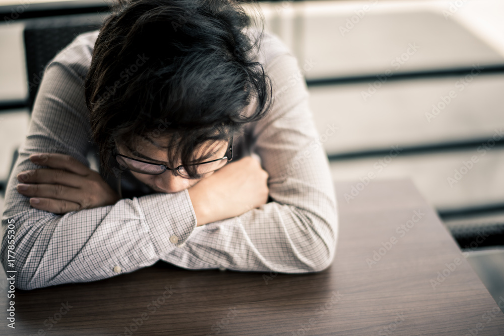 business man is stressed from his work. depression and anxiety concept.