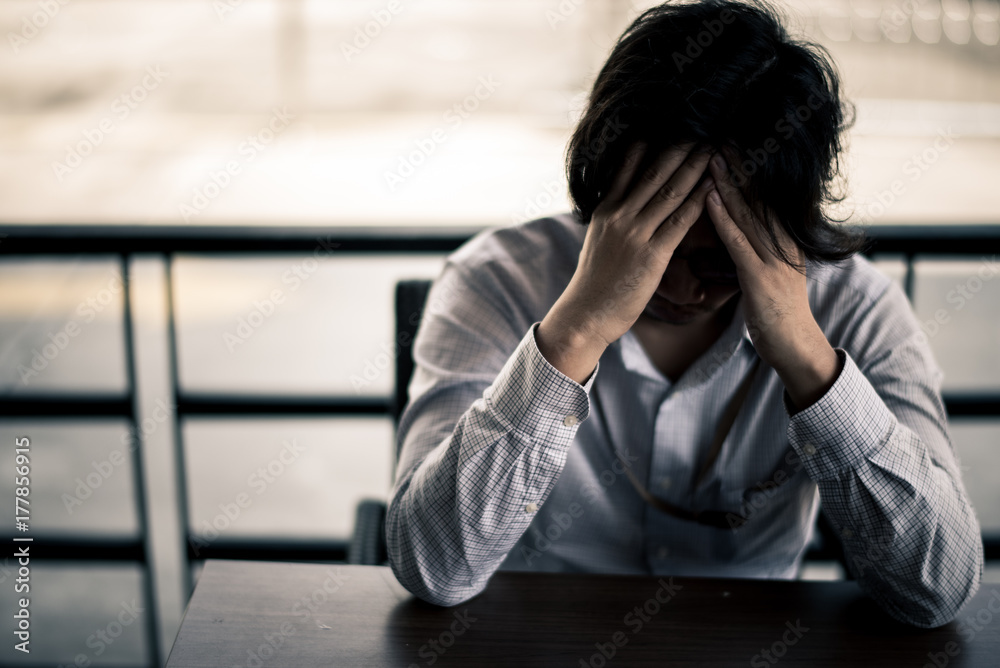 business man is stressed from his work. depression and anxiety concept. business man is stressed from his work. depression and anxiety concept.