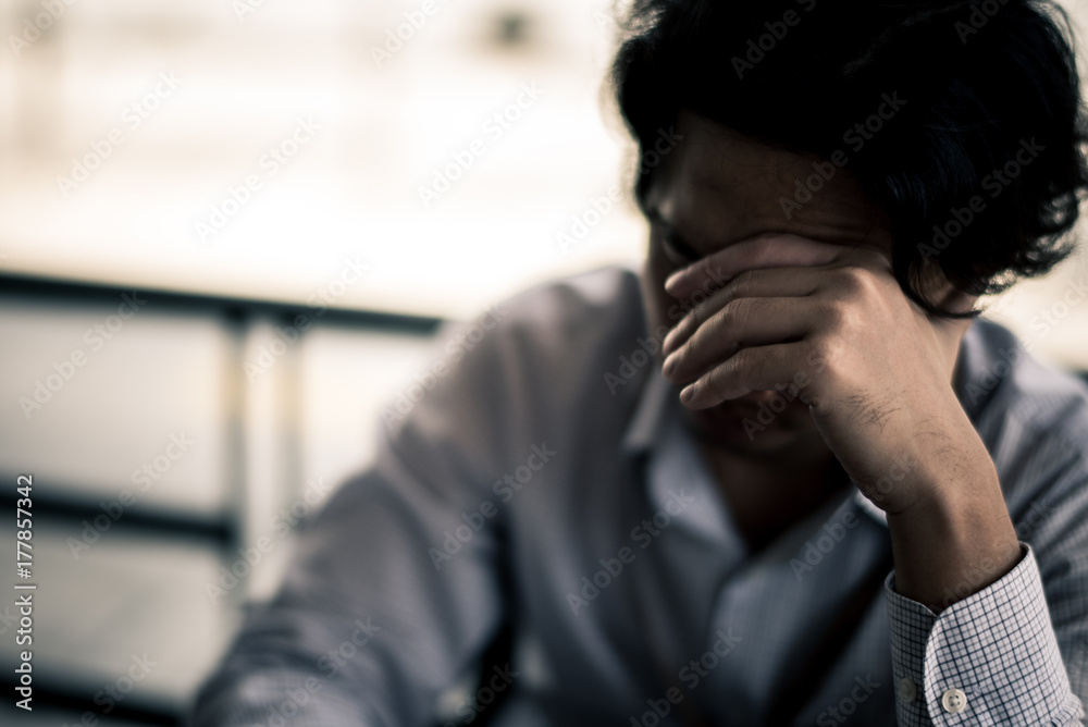 business man is stressed from his work. depression and anxiety concept.