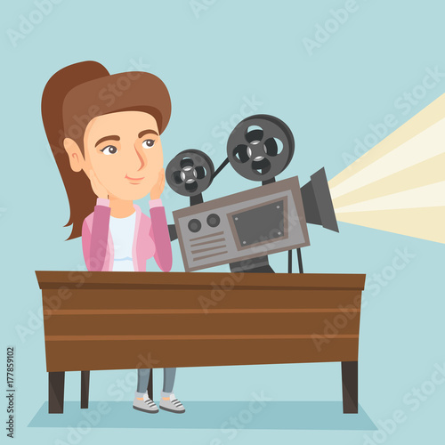 Caucasian woman sitting at the table with film projector in the room of projectionist. Projectionist showing a new film. Young projectionist at work. Vector cartoon illustration. Square layout.