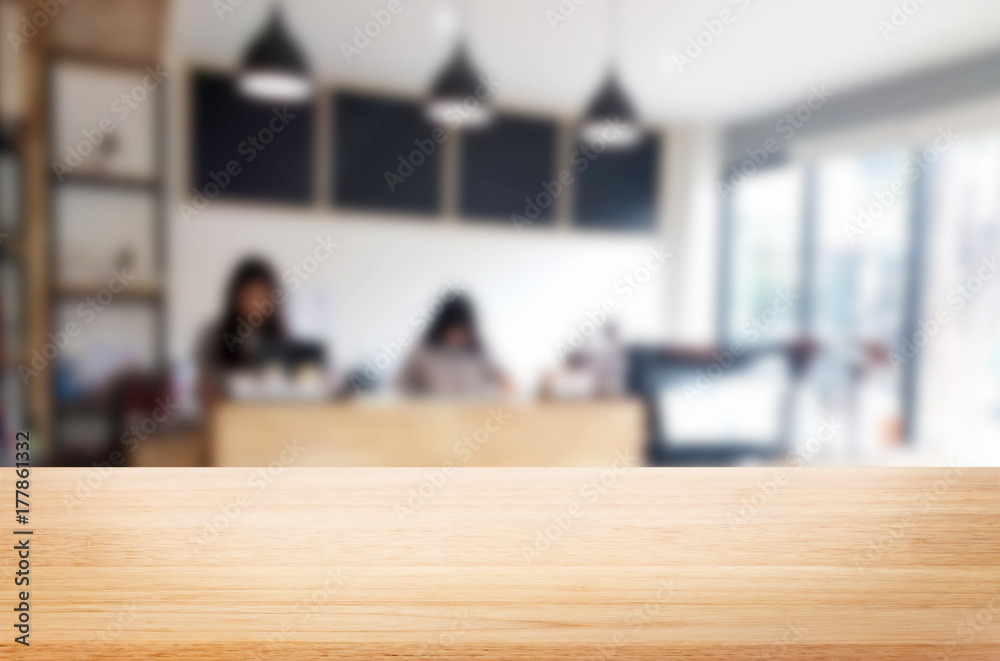 Selected focus empty brown wooden table and Coffee shop blur background with bokeh image. for your photomontage or product display Selected focus empty brown wooden table and Coffee shop blur background with bokeh image. for your photomontage or product display