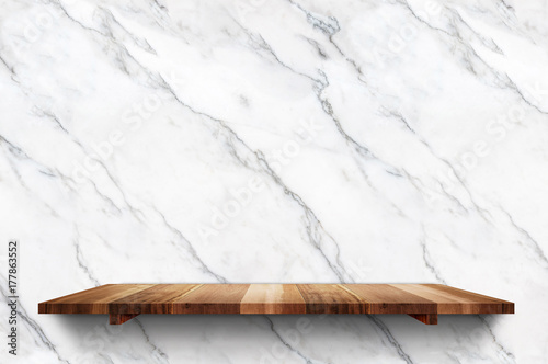 Empty wood plank shelf at white marble wall background,Mock up for display or montage of product or design.
