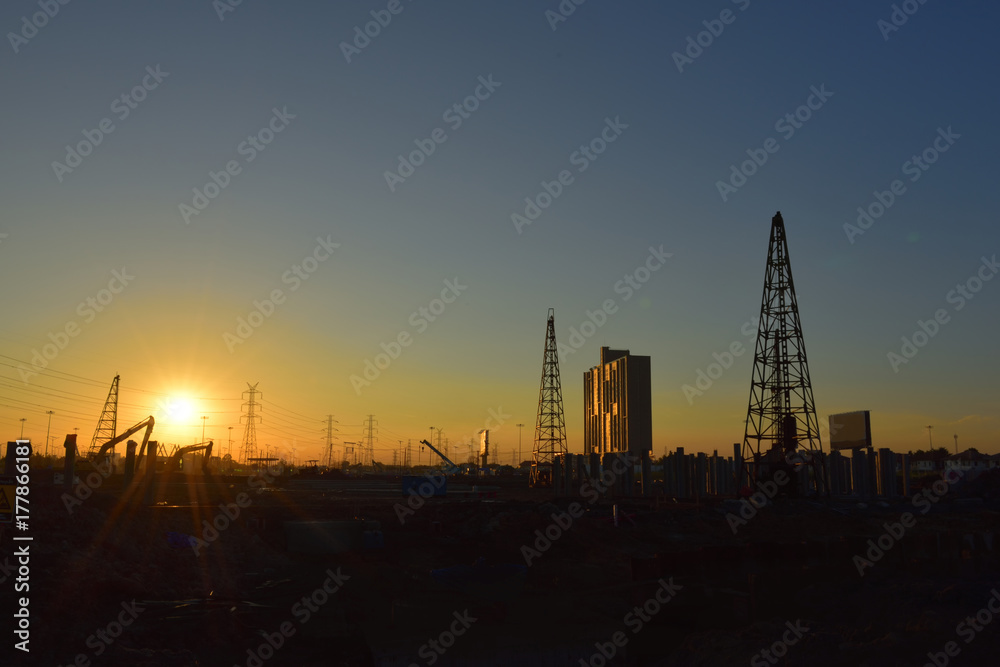 construction site and electrical Pole with Sunrise sky.