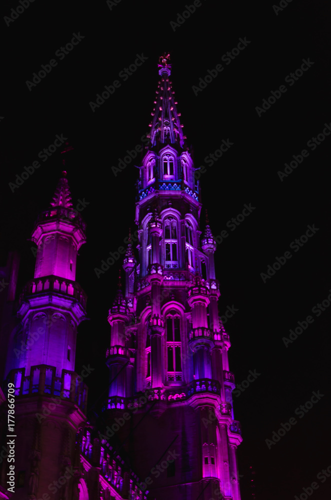 Pink and Purple Illuminated Church Steeple at Night
