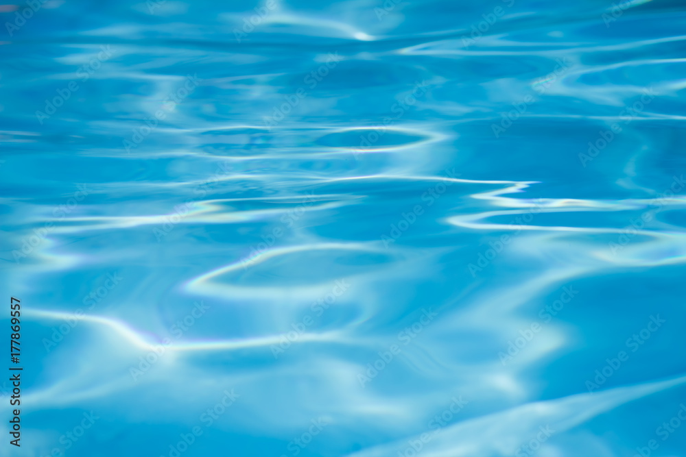 Detail of sunlight on waving swimming pool water Detail of sunlight on waving swimming pool water