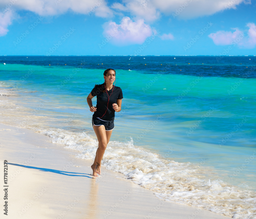 Latin girl running in caribbean shore beach Latin girl running in caribbean shore beach