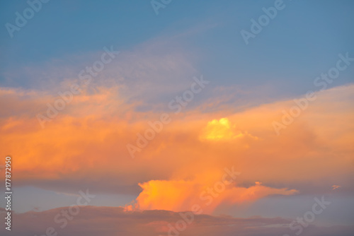 Sunset sky orange clouds on blue © lunamarina