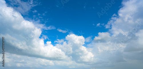 Blue summer sky white cumulus clouds © lunamarina