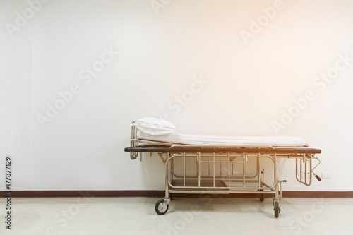 Fototapeta Empty stretcher trolley or hospital trolley for patient with white room