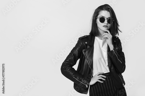 Young beautiful woman in a black jacket. Black and white image