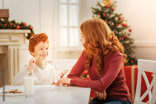 Positive minded family writing letter to santa claus