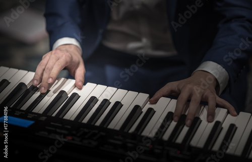 Playing electric piano, Right hand focused photo