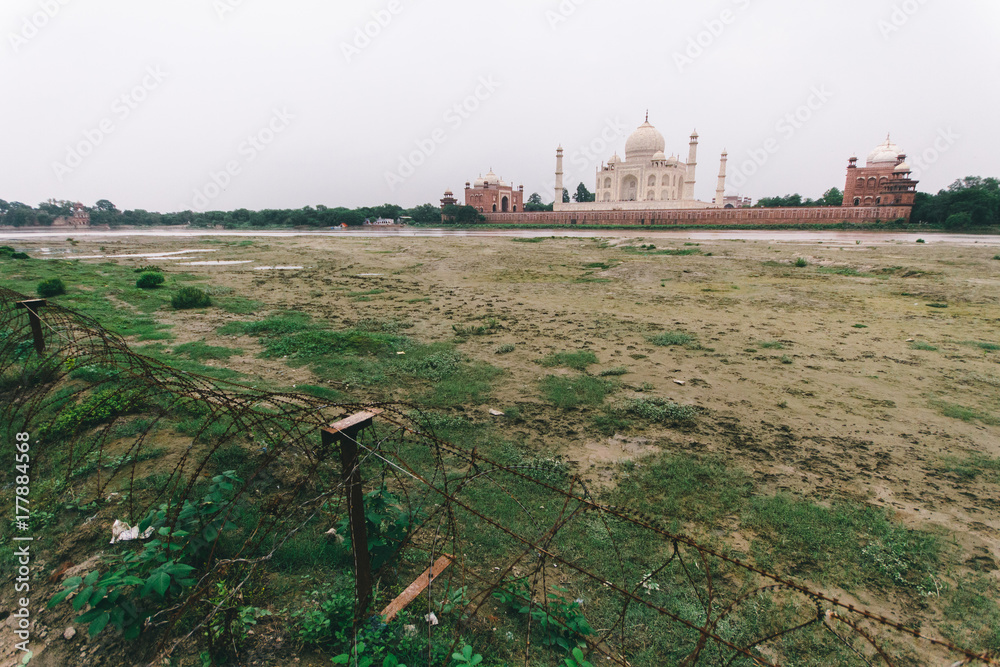 Taj Mahal and wire cables seen from the other side of Yamuna river. Agra,  India Photos | Adobe Stock