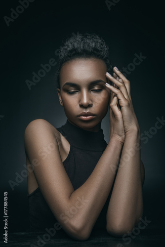 fashionable girl posing with closed eyes
