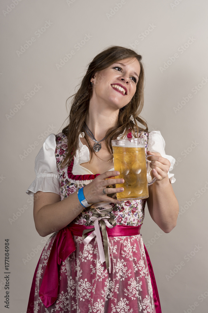 Lady in Floral Dirndl Holding Crystal Mug Filled with Beer Lady in Floral Dirndl Holding Crystal Mug Filled with Beer