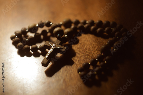 wooden rosary on th eold wooden table photo