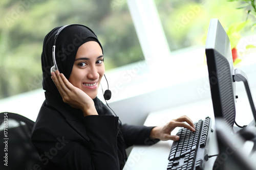 Beautiful muslim business woman smiling at camera