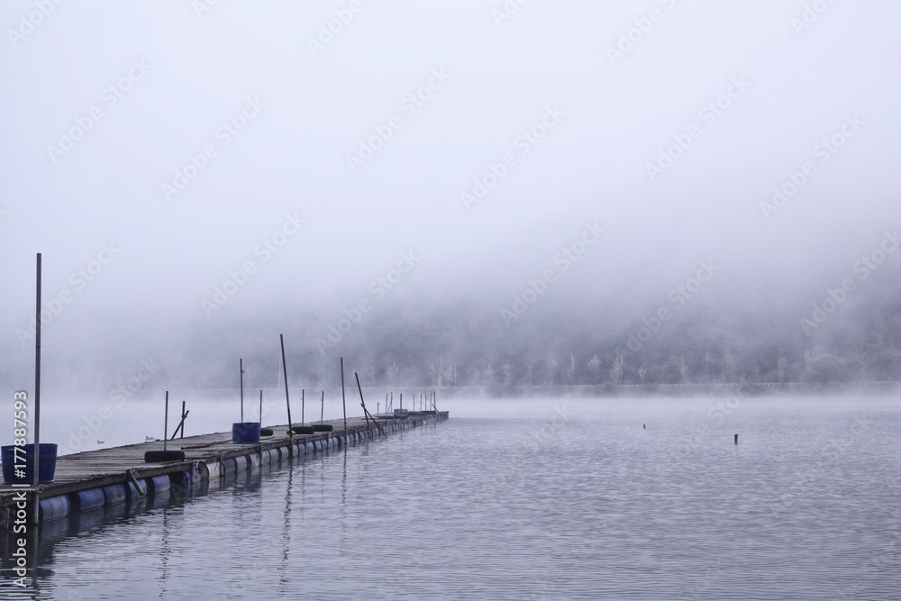 Obraz premium Landscape of MunGwang Reservoir with early morning fog, Chungcheongbuk-do Province Goesan, South Korea