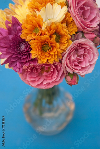 Flower orange bouquet of orange spray chrysanthemum and pink roses view from the top, isolated
