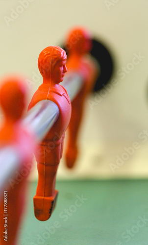 Table football, foosbal red and blue players in macro view photo