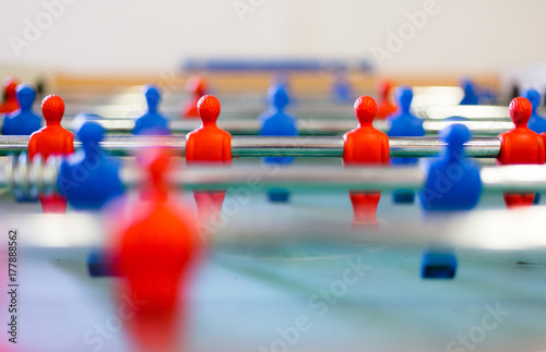 Table football, foosbal red and blue players in macro view