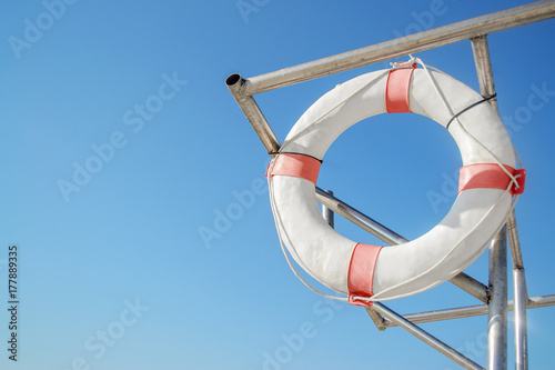 Old life ring/lifebuoy  hanging on boat supports, Sironit beach, Netanya, Israel