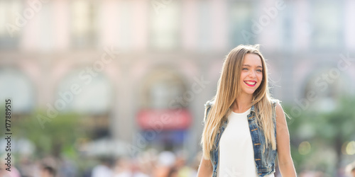 Happy young girl outdoor, horizontal banner photo with defocused copy space on the left
