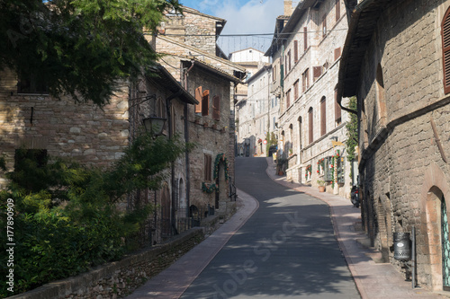 Historic buildings line the stone streets of Assisi  Umbria  Italy