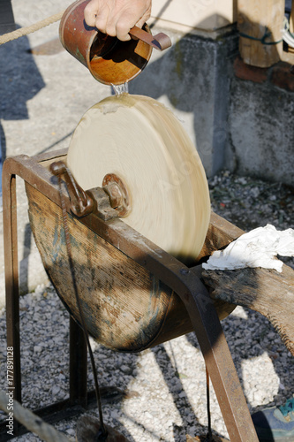 old stone grinding wheel