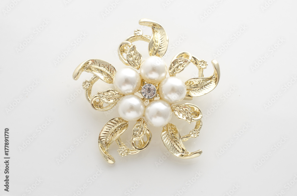 gold brooch flower with pearl isolated on white gold brooch flower with pearl isolated on white